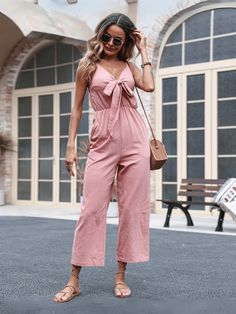 Get ready to turn heads in our Kenia V-Neck Bow Tie Jumpsuit! This stunning, blush pink jumpsuit features a flattering v-neckline and a playful bow tie detail. Perfect for a fun and flirty look, this jumpsuit will make you the life of the party. (Jumpsuit, party, pink, playful) Size Guide: Model is 5’7” tall, and has a 33.6” bust, 24.6”waist, & 37.5” hips. She is wearing a S / US 4 / AU 8. This jumpsuit is true to size. Material: 65% Polyester. 35% Cotton. Feature: V-neckline. Front Bow-Tie. Sleeveless. Side Pocketed. Side zipper closure. Relax fit. Care Instructions: Machine wash / Cold hand wash Purple Jumpsuits, Blush Pink Jumpsuit, Summer Overalls, Pink Overalls, Party Jumpsuit, Overalls Casual, Neck Bow, Pink Jumpsuit, Linen Jumpsuit