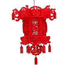 a red chinese style wind chime hanging from the ceiling