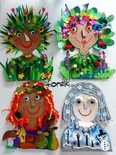 four children's paper dolls made to look like they are wearing flowers and leaves