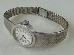 Offered for sale; Original 1970s ladies cocktail bracelet watch, dial marked UNIONA II ANTICHOC Solid 800 standard silver case and bracelet. The back hallmarked 800 Hand winding Swiss 17 jewel mechanical movement, winds fully and runs well keeping good time. Strong two position clasp bracelet, will fit a maximum wrist size of 6,1/2" or 165mm Stylish collectible watch in very good condition, for occasional use, not shock or waterproof, some light tarnishing to the silver Guaranteed old and origin Retro Round Silver Watch Accessories, Retro Silver Watch Accessories For Anniversary, Retro Silver Watch Accessories For Formal Occasions, Vintage Silver Watch With Metal Dial, Vintage Silver Watch With Bracelet Strap, Silver Vintage Watch With Bracelet Strap, Vintage Silver Watch Accessories, Vintage Silver Bracelet Strap Watch, Collectible Watch