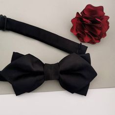 "This listing is my version of the James Bond boutonniere.  Made of satin fabric. Size of the flowers is 1.8\". The difference between the pin options is more personal nature. I guess if you have a button hole on your jacket you could go for button that you put thru. If you don't want to make a hole you can choose clutch that has a single pin and it is recommended for all purposes because you can wear such flower also on sweaters... Brooch usually order woman, stick is my most favorable because you have two pin styles you can go for. First you can wear your boutonniere that the stick is seen in front of the jacket or you can double pin the stick back and it is not seen. Just like you wish and it is also a safest pin, besides brooch.  Colors might be slightly different according with your m Black Satin Tuxedo For Party, Classic Black Bow Tie For Groom, Classic Black Ribbon Bow Tie For Wedding, Elegant Red Bow Tie For Wedding, Black Bow Tie For Groom, Groomsmen Burgundy, Lapel Flower Wedding, Boutonniere Groomsmen, Boutonniere Wedding Rustic