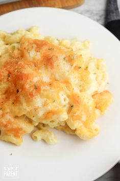 a white plate topped with macaroni and cheese