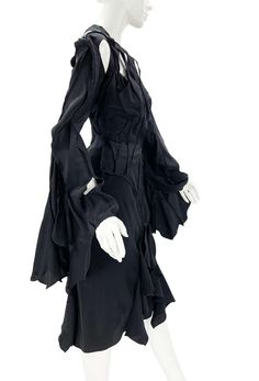 For Sale on 1stDibs - Tom Ford for Yves Saint Laurent Rive Gauche Skirt Suit S/S 2003 Runway Collection - Look 9 French size 38 - US 6 100% Silk, Black Color. Top - Cutout Details, Designer Silk Skirt, Designer Fitted Silk Skirt, Silk Fitted Skirt With Ruffles, Silk Black Skirt, 2003 Runway, Black Skirt Suit, Silk Suit, Rive Gauche, Runway Collection