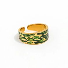 Enhance your style with the Court Green Wave Ring. This finely crafted ring boasts a perfect fit and a luxurious gold interior, making it a true statement piece. Elevate any outfit with this elegant and unique accessory. Yellow Gold Enamel Open Ring, Gold Enamel Open Ring, Green Enamel Open Ring, Gold Enamel Open Ring With Polished Finish, Trendy Gold Enamel Open Ring, Trendy Gold Open Enamel Ring, Trendy Gold Open Ring, Trendy Adjustable Gold Enamel Ring, Trendy Gold Enamel Ring As Gift