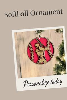 a baseball ornament hanging from a christmas tree with the text softball ornaments personalize today