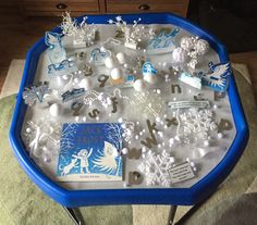 a blue tray filled with lots of different types of items on top of a table