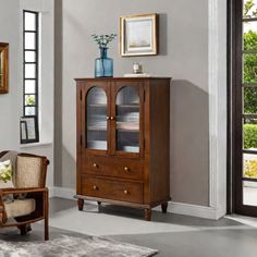 a living room scene with focus on the armoire