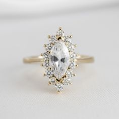 Shown in 1.25 Carat * The Hadley Marquise Diamond Engagement Ring | Lisa Robin#color_14k-yellow-gold Marquise Engagement Ring Halo, Engagement Ring Quiz, Round Diamond Halo Engagement Ring, Round Diamond Engagement Rings Halo, Marquise Diamond Engagement Ring, Colored Engagement Rings, Buying An Engagement Ring, Halo Design, Engagement Rings Marquise