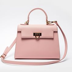 Feminine Pink Top Handle Bag -Chic & Versatile. Introducing our latest collection addition, Layla Bag in Pink. Lean into the femininity of a soft pink bag, perfect for spring and summer. This new-season Enjoy the versatility of Layla Bag with its adjustable strap, allowing you to wear it comfortably as a crossbody or shoulder bag, depending on your style preference. Bag Specifications Material: Vegan leather Interior: Luxurious suede lining Handles: Single handle, Removable shoulder strap Hardwa Pink Handbags, Chic Pink, Pink Top, Handle Bag, Chic Fashion, Pink Tops, Pink Bag, Leather Interior, Shoulder Handbags