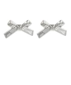 Indulge in the ribbon and bow trend with these fun metallic earrings. Featuring a ribbon design and a silver shine, they are sure to make a statement with any outfit! Acrylic Post back 3/4" L Available in silver only Chic Silver Jewelry With Bow Tie Detail, Chic Silver Earrings With Decorative Bow, Silver Party Jewelry With Satin Bow, Silver Jewelry With Satin Bow For Party, Chic Silver Jewelry With Ribbon, Silver Satin Bow For Party, Silver Satin Party Bow, Silver Ribbon Earrings For Formal Occasions, Bow Trend