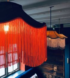 an orange chandelier hanging from the ceiling