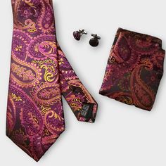 Treat yourself with a new pattern and splash of color to your look with this unique tie set. 100% Silk Handmade Package Includes: Tie, Pocket Square & Cufflinks. Length: 59" Width: 3.34" Warm iron if needed Elegant Multicolor Formal Sets, Elegant Multicolor Sets For Gift, Elegant Multicolor Sets For Gifts, Elegant Multicolor Sets As Gift, Elegant Multicolor Sets As A Gift, Camellia Red, Gold Paisley, Unique Ties, Cufflink Set