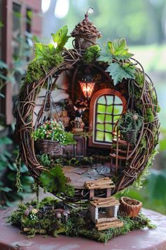 a miniature house made out of wicker and plants in the shape of a circle