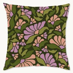 a green and pink pillow with flowers on it