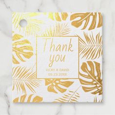 a thank card with gold foil leaves and a square frame that says, thank you