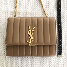 This Is An Authentic Saint Laurent Lambskin Matelasse Monogram Vicky Chain Wallet In Peru (Beige). This Bag Is Crafted Of Beige Lambskin Leather With A Vertically Lined Quilt And Is Stunning! In Great Condition. Dust Bag And Tag (As Pictured) Included Ysl Beige Handbag, Beige Ysl Bag, Cream Ysl Bag, Ysl Bag Cream, Ysl Monogram Chain Wallet, Bags Ysl, Saint Laurent Bags, Chain Wallet, Yves Saint Laurent Bags