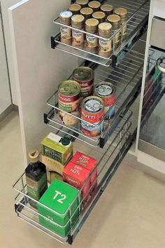 an organized spice rack in a kitchen with spices and seasonings on the bottom shelf