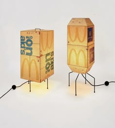 two cardboard boxes sitting on top of each other in the shape of mcdonald's