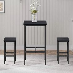 three stools and a table in a room