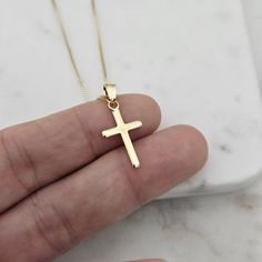 "18k Gold Crucifix Necklace Gold Cross Necklace Unisex Gold Cross Pendant Christian Jewelry Gift for her  Boyfriend Gift Gold  Small Cross This beautiful necklace is a gift of Faith a 18K Gold Filled cross pendant on a Box chain are a special gift for someone you love or just if you want to treat yourself. Perfect for a First Communion gift, birthday gift, Easter gift, Father's Day gift, Valentine's Day gift, wedding gift, or anniversary gift, this chain is an elegant piece of jewelry for those looking for a high-quality accessory. , its classic design blends perfectly with any style from casual to elegant. chain measurements 14\" 16\" 18\" 20\" *Cross 22mm" Minimalist Cross Pendant Chain Necklace As Gift, Minimalist Chain Necklace With Cross Pendant As Gift, Sterling Silver Cross Pendant Necklace For Gifting, Sterling Silver Cross Pendant Necklace Gift, Elegant Gold Cross Necklace For Mother's Day, Yellow Gold Cross Pendant Charm Necklace As Gift, Tarnish Resistant Cross Pendant Necklace Gift, Gold Plated Pendant Cross Necklace Gift, Yellow Gold Cross Pendant Chain Necklace As Gift