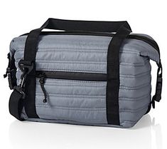 a gray and black duffel bag sitting on top of a white floor