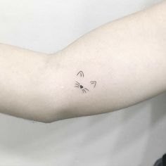 a person with a tattoo on their arm