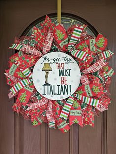 a wreath that says no - go - lay that must be italian on the front door