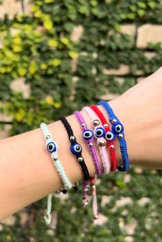 Handmade Evil Eye thread bracelets in several colors. Adjustable. Handmade Adjustable Nylon Thread Bracelets, Handmade Adjustable Nylon Thread Bracelet, Handmade Nylon Thread Bracelets For Friendship, Handmade Pink Nylon Cord Friendship Bracelets, Handmade Nylon Thread Friendship Bracelets, Handmade Pink Braided Nylon Cord Bracelet, Handmade Adjustable Friendship Bracelets In Nylon, Casual Nylon Thread Bracelets As Gift, Adjustable Thread Braided Bracelets