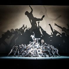 a group of people standing on top of a stage