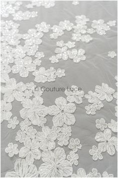 Romantic, classic bridal lace fabric with floral design ❀❀ CHARACTERISTICS ❀❀ Color: off-white Yarn: Cotton Mesh: Nylon tulle Sequins: Yes - silver Beads: NO Cording: NO ❀❀ MEASUREMENTS ❀❀  Listed per- 1 yards (yds) / 91,44 cm (0,91 Meter) - if you order more than 1yds, you'll get the lace in one continuous full piece.  Width of embroidery // Width of full tulle: 133-153cm // 52.3" - 60.2" ❀❀ SAMPLE SWATCHES❀❀ If you want to check the color and quality, you can order a swatch here (READ DESCRIPT Elegant Lace Sequin Fabric With Floral Applique, White Embroidered Fabric With Scalloped Lace For Wedding, White Lace Embroidered Fabric With Sequins, Elegant White Sequin Fabric With Floral Applique, White Lace Tulle Fabric With Sequins, Elegant White Lace With Sequins, Cream Lace Sequin Fabric For Wedding, Elegant White Sequined Lace, Cream Lace With Floral Applique