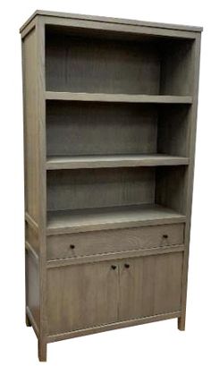 an old bookcase with drawers and cupboards