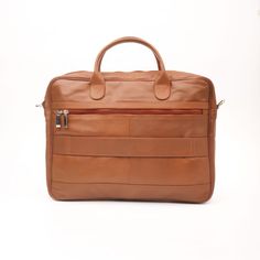 a tan leather briefcase with two compartments and zippers on the front, sitting against a white background