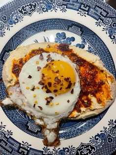 an egg is sitting on top of a piece of bread