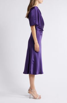 A graceful drape defines the chic silhouette of this toastworthy cocktail dress cut to a beloved midi length. 46 1/2" length (size 8) One-shoulder neck Elbow-length sleeves Lined 100% polyester Dry clean Imported Black Owned/Founded Purple Cocktail Midi Dress With Fitted Bodice, Formal Pre-draped Knee-length Midi Dress, Purple Midi Dress With Fitted Bodice For Cocktail, Pre-draped Midi Dress With Draped Sleeves For Gala, Elegant Off-shoulder Midi Dress With Draped Sleeves, Elegant Purple Midi Dress With Fitted Bodice, Elegant Purple Midi Dress For Evening, Elegant Purple Midi Evening Dress, Elegant Purple Cocktail Evening Dress