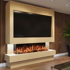 a living room with a large television mounted on the wall and a fire place in front of it