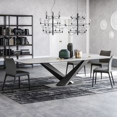 a dining table with chairs and a chandelier