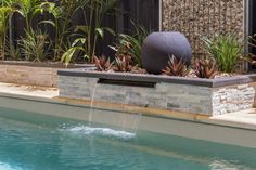 a water feature in the middle of a swimming pool