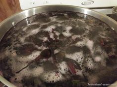 a pan filled with boiling liquid on top of a stove