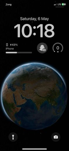 an image of the earth from space with time and date displayed on it's screen