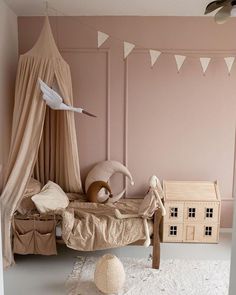 a bedroom with pink walls and white rugs