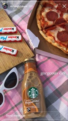 a bottle of starbucks coffee next to sunglasses and a pizza with pepperoni on it