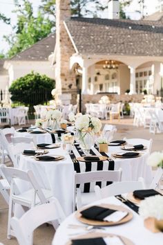 black and white tables with gold place settings