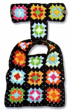 two crocheted bibs with different colors and designs on the front, one is black