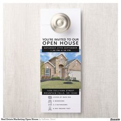 an open house door hanger with a photo on it