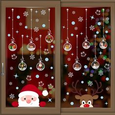 christmas window stickers with santa claus and reindeer hanging from the glass, decorated with snowflakes