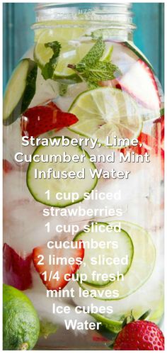 a jar filled with cucumber and mint infused water next to sliced strawberries