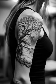 a woman with a tree tattoo on her arm