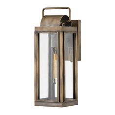 an outdoor wall light with a metal frame and glass panels on the front, one light is