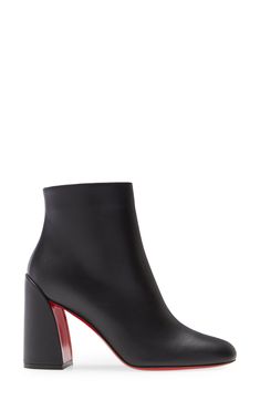 A curvy architectural heel shows off a glimpse of the Louboutin-red sole on this walkable, around-town bootie done in supple Italian calfskin. 4" (85mm) heel (size 39.5) 5" shaft Side zip closure Wipe with a soft, dry cloth and store in a dust bag Please note that the red lacquer on the soles will wear off as a result of normal use. To minimize the effect, avoid wearing these shoes in wet weather or on abrasive surfaces Leather upper, lining and sole Made in Italy Women's Designer Shoes Chic Calf Leather Heeled Boots With Rubber Cap, Chic High Ankle Heeled Boots With Rubber Heel Cap, Bold Ankle Boots With Reinforced Heel, Modern Calf Leather Heeled Boots With Contrasting Heel, Modern Heeled Boots With Contrasting Heel, Bold Leather Ankle Heeled Boots, Bold Leather Ankle Boots, Modern Heeled Boots With Contrasting Heel Counter For Evening, Calf Leather High Heeled Boots With Rubber Cap