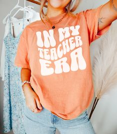 Whether you're a new teacher just starting out or a seasoned pro, this shirt is a fun and lighthearted way to show off your passion for teaching. DETAILS * Comfort Colors Garment-Dyed Heavyweight T-Shirt * 100% ring spun cotton * Design is printed using DTG technology which uses high-quality water-based inks that are printed directly into the fabric. This means that there may be a slightly faded/vintage look to the design depending on the color and fabric of the garment. SIZING * These unisex T- Future Teacher Shirts Designs, School Spirit Tops With Funny Print For Teacher Appreciation, Fun T-shirt With Funny Print For Teacher Appreciation, Graphic Tee With Text Print For Teaching, Funny Cotton T-shirt For Teaching, Funny Slogan T-shirt For Teacher Appreciation, School Spirit T-shirt With Text Print For Teacher Appreciation, School Spirit Tops With Slogan For Teacher Appreciation, School Spirit Top With Slogan For Teacher Appreciation